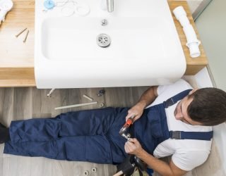 sanitary technician working with sink